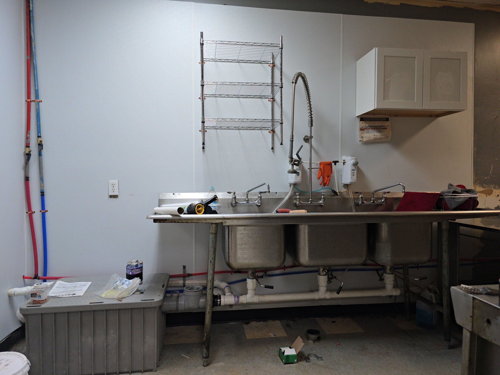 Three-compartment commercial sink with PEX supply and PVC drain